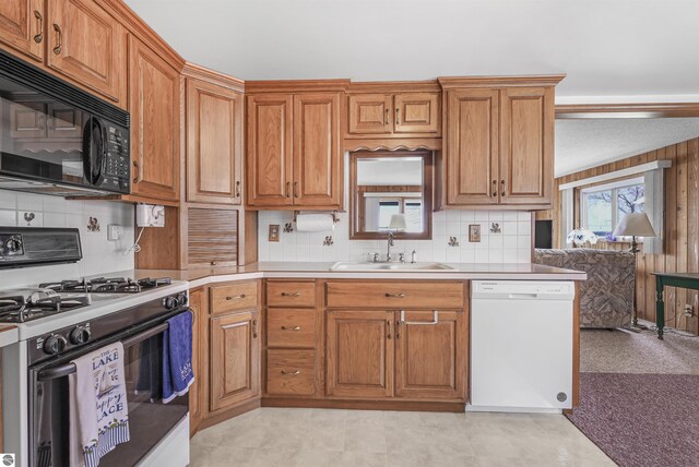 8805 Iroquois Trl, Saint Helen, MI 48656 - kitchen featuring white appliances, a sink, and brown cabinetry