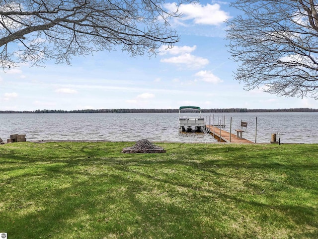 8805 Iroquois Trl, Saint Helen, MI 48656 - dock featuring a water view and a lawn