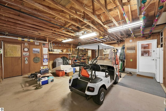 8805 Iroquois Trl, Saint Helen, MI 48656 - garage with freestanding refrigerator