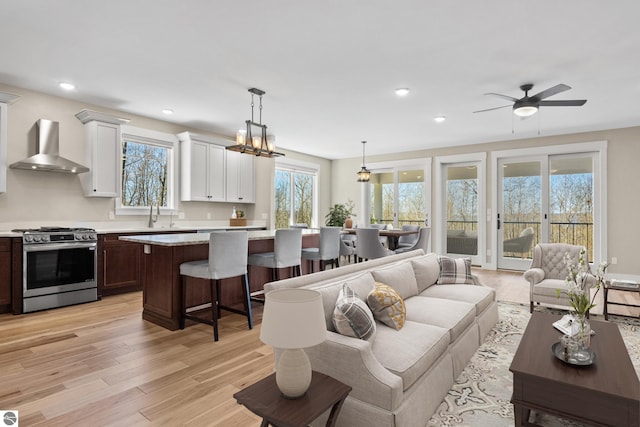 3046 E Greenwood Rd, Lake Leelanau, MI 49653 - living area featuring light wood finished floors, recessed lighting, and a ceiling fan