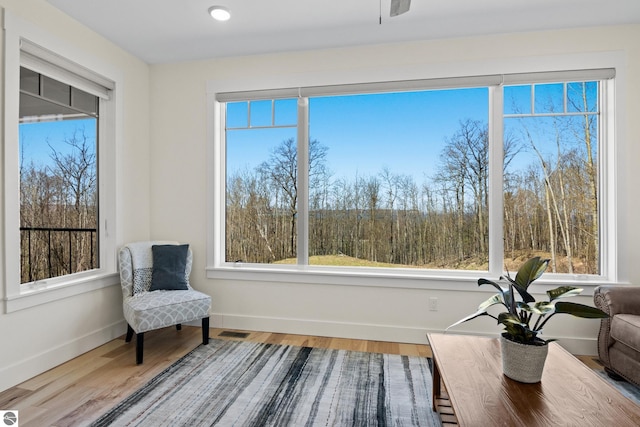 3046 E Greenwood Rd, Lake Leelanau, MI 49653 - living area with wood finished floors, baseboards, and recessed lighting