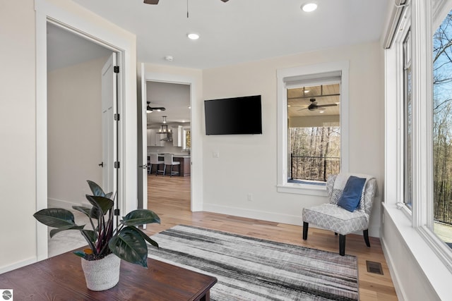 3046 E Greenwood Rd, Lake Leelanau, MI 49653 - sitting room with ceiling fan, light wood-style flooring, baseboards, and recessed lighting