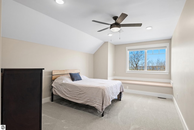 3046 E Greenwood Rd, Lake Leelanau, MI 49653 - bedroom featuring light colored carpet, vaulted ceiling, baseboards, recessed lighting, and ceiling fan