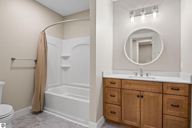 3046 E Greenwood Rd, Lake Leelanau, MI 49653 - full bath featuring toilet, baseboards, shower / bath combo with shower curtain, marble finish floors, and vanity