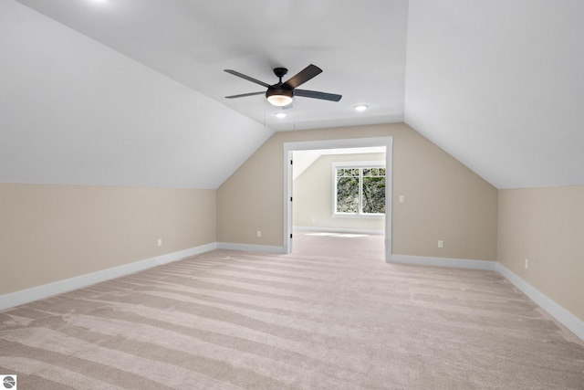 3046 E Greenwood Rd, Lake Leelanau, MI 49653 - additional living space featuring light carpet, ceiling fan, vaulted ceiling, baseboards, and recessed lighting