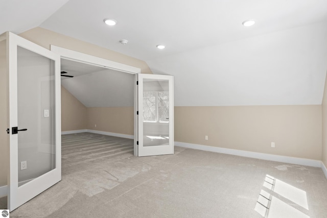 3046 E Greenwood Rd, Lake Leelanau, MI 49653 - bonus room featuring vaulted ceiling, light carpet, baseboards, and recessed lighting