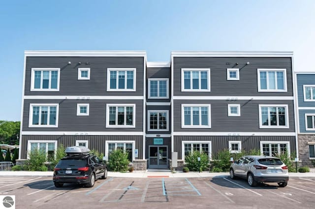 914 E Front St Unit 16, Traverse City, MI 49686 - view of building exterior with uncovered parking