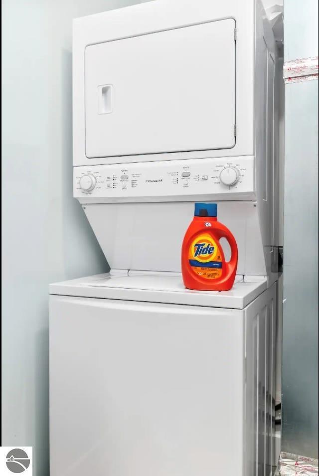 914 E Front St Unit 16, Traverse City, MI 49686 - laundry area featuring estacked washer and dryer