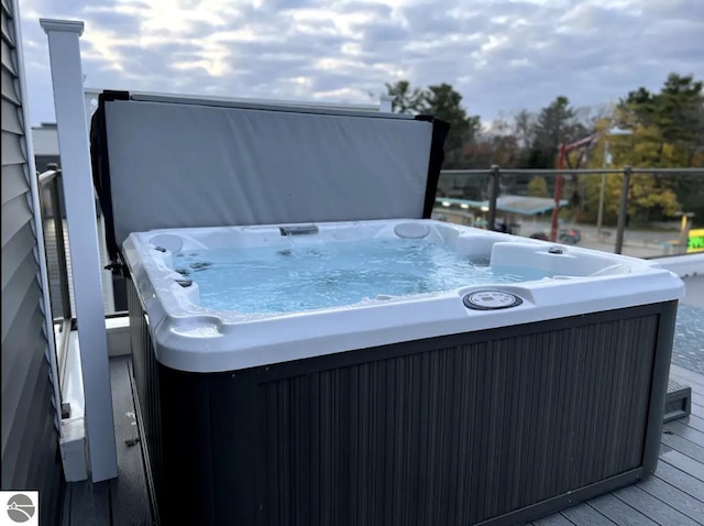 914 E Front St Unit 16, Traverse City, MI 49686 - wooden terrace with a hot tub