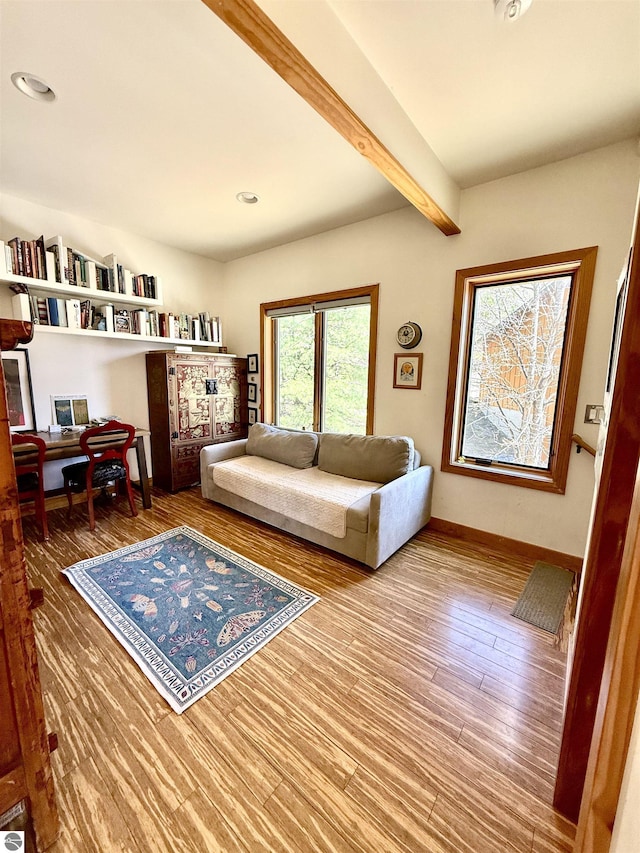 living room with wood finished floors, beam ceiling, baseboards, an office area, and recessed lighting