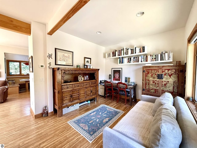 living area with beam ceiling, wood finished floors, baseboards, and recessed lighting