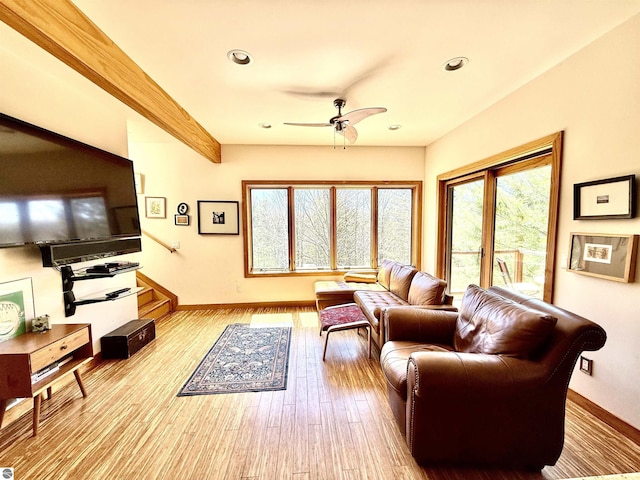 living area with a ceiling fan, healthy amount of natural light, baseboards, recessed lighting, and wood finished floors