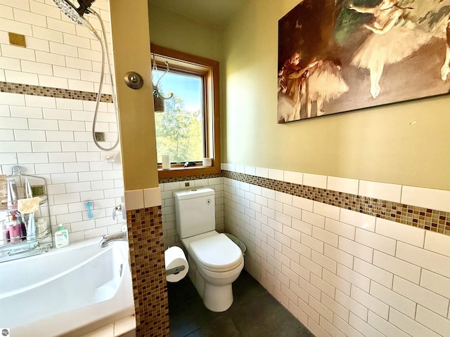full bath with tile walls, toilet, a shower, wainscoting, and tile patterned floors