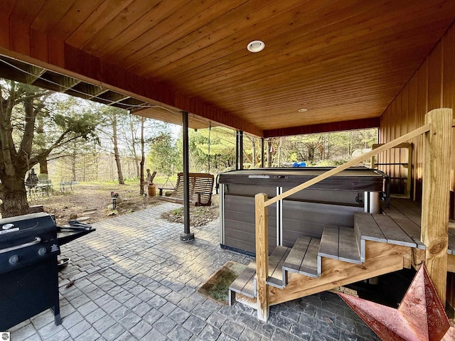 view of patio / terrace featuring a hot tub
