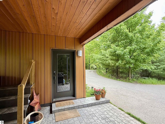 10959 E Pobuda Rd, Suttons Bay, MI 49682 - property entrance with board and batten siding