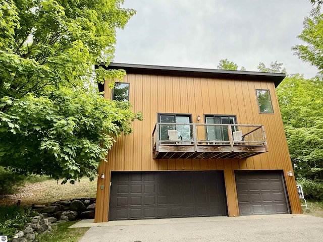 10959 E Pobuda Rd, Suttons Bay, MI 49682 - view of front of property with a balcony