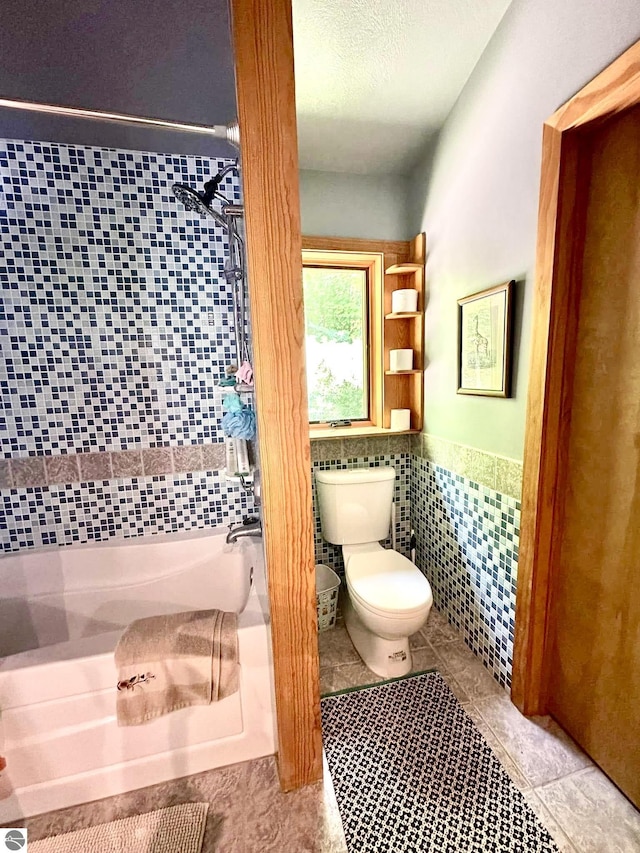 10959 E Pobuda Rd, Suttons Bay, MI 49682 - full bath featuring tile walls, tile patterned flooring, and wainscoting