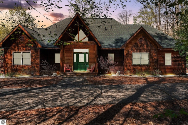4854 Forest Trl, Bellaire, MI 49615 - view of front of house featuring a shingled roof