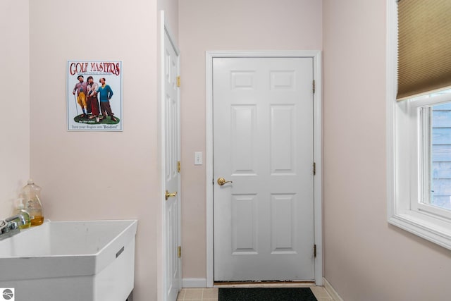 4854 Forest Trl, Bellaire, MI 49615 - entryway with a sink and baseboards