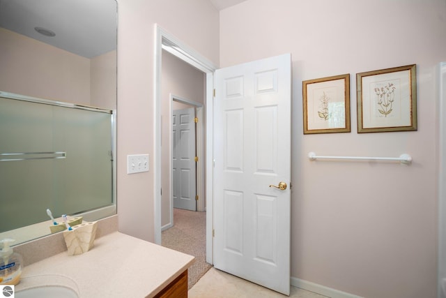 4854 Forest Trl, Bellaire, MI 49615 - bathroom featuring vanity, baseboards, and a shower with shower door