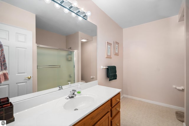 4854 Forest Trl, Bellaire, MI 49615 - bathroom featuring a shower with shower door, vanity, baseboards, and toilet