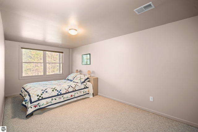 4854 Forest Trl, Bellaire, MI 49615 - carpeted bedroom featuring baseboards