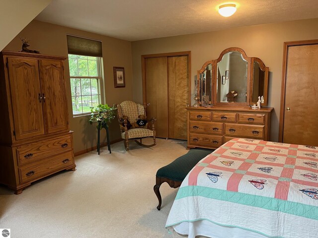 6557 Betsie River Rd, Interlochen, MI 49643 - bedroom featuring light colored carpet