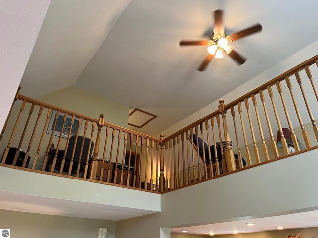 6557 Betsie River Rd, Interlochen, MI 49643 - staircase featuring a ceiling fan, high vaulted ceiling, and recessed lighting