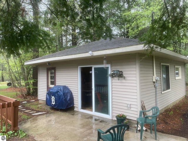 6557 Betsie River Rd, Interlochen, MI 49643 - rear view of property featuring a patio