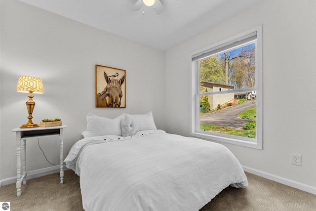 4306 Central Park Dr, Grawn, MI 49637 - carpeted bedroom featuring baseboards and ceiling fan