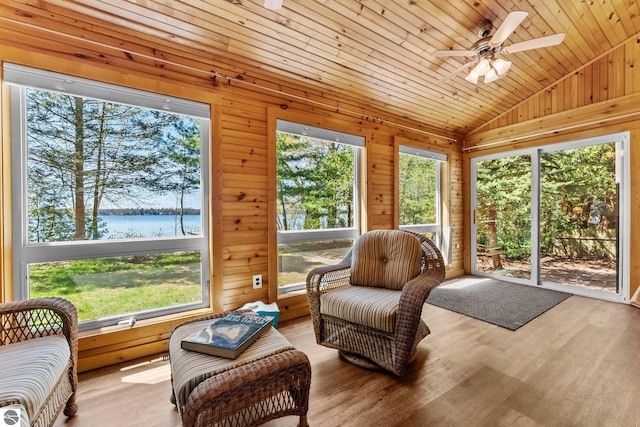4306 Central Park Dr, Grawn, MI 49637 - sunroom / solarium featuring a water view, ceiling fan, and lofted ceiling
