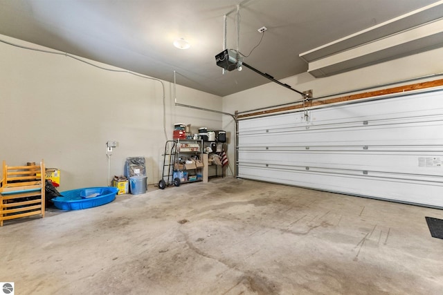 4306 Central Park Dr, Grawn, MI 49637 - garage with a garage door opener
