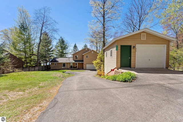 4306 Central Park Dr, Grawn, MI 49637 - view of front of property with a garage and an outdoor structure