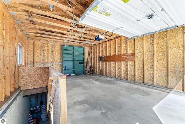 4306 Central Park Dr, Grawn, MI 49637 - garage featuring a garage door opener