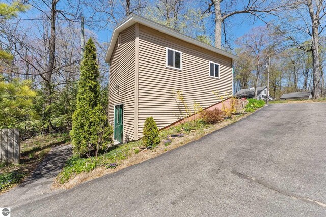 4306 Central Park Dr, Grawn, MI 49637 - view of property exterior featuring driveway