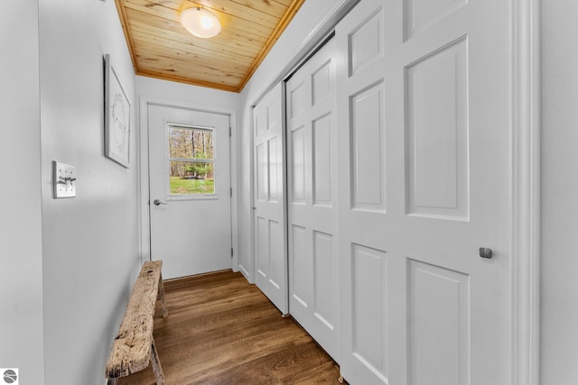 4306 Central Park Dr, Grawn, MI 49637 - doorway to outside with wood ceiling, dark wood-style floors, and crown molding