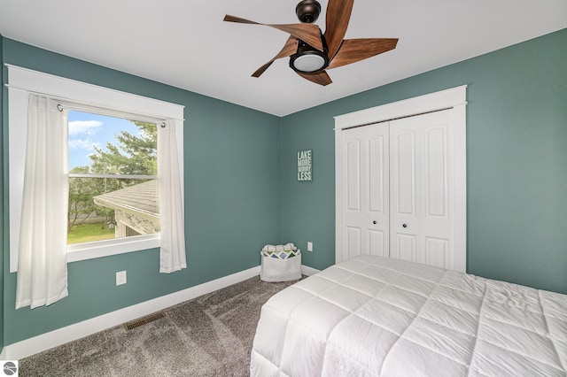 1254 Queensway Dr, Lake Isabella, MI 48893 - carpeted bedroom featuring a closet, baseboards, and ceiling fan