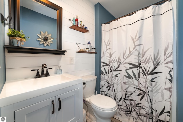 1254 Queensway Dr, Lake Isabella, MI 48893 - full bathroom with toilet, vanity, wood walls, and curtained shower