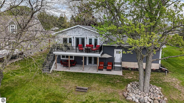 1254 Queensway Dr, Lake Isabella, MI 48893 - rear view of property with a patio area, a deck, a lawn, stairs, and french doors