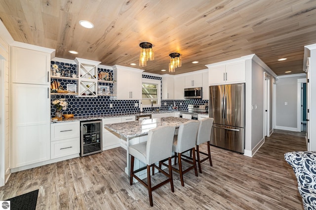 1254 Queensway Dr, Lake Isabella, MI 48893 - kitchen featuring stainless steel appliances, wine cooler, open shelves, decorative backsplash, and wood ceiling