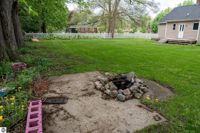 1618 E High, Mount Pleasant, MI 48858 - view of yard featuring an outdoor fire pit and a wooden deck