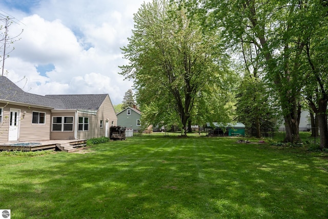 1618 E High, Mount Pleasant, MI 48858 - view of yard with a wooden deck