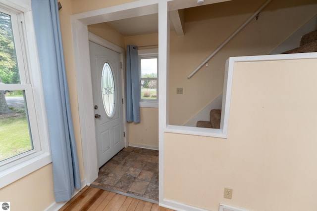 1618 E High, Mount Pleasant, MI 48858 - entryway featuring stairway, plenty of natural light, baseboards, and stone finish flooring