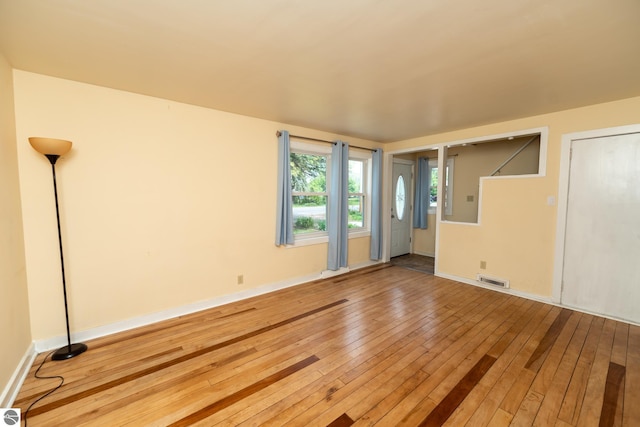 1618 E High, Mount Pleasant, MI 48858 - unfurnished room with hardwood / wood-style flooring and baseboards