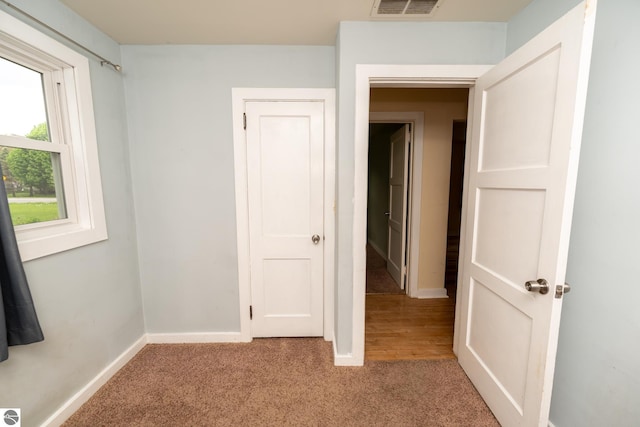 1618 E High, Mount Pleasant, MI 48858 - unfurnished bedroom with light carpet and baseboards