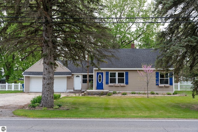 1618 E High, Mount Pleasant, MI 48858 - view of front of home featuring a garage, driveway, a chimney, and roof with shingles