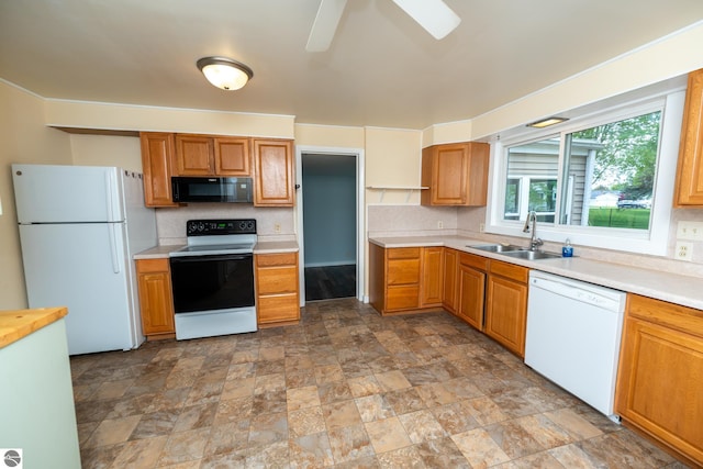 1618 E High, Mount Pleasant, MI 48858 - kitchen featuring white appliances, a sink, light countertops, stone finish floors, and tasteful backsplash