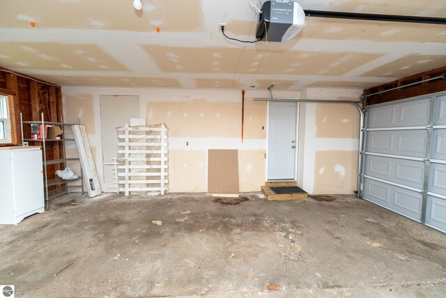 1618 E High, Mount Pleasant, MI 48858 - garage featuring a garage door opener