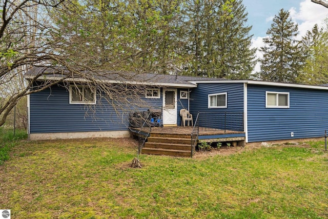 8817 Wilson Rd, Buckley, MI 49620 - back of house with a deck and a yard