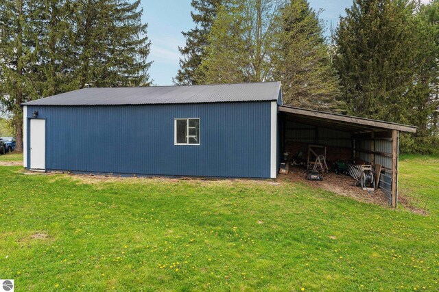 8817 Wilson Rd, Buckley, MI 49620 - view of pole building featuring a lawn
